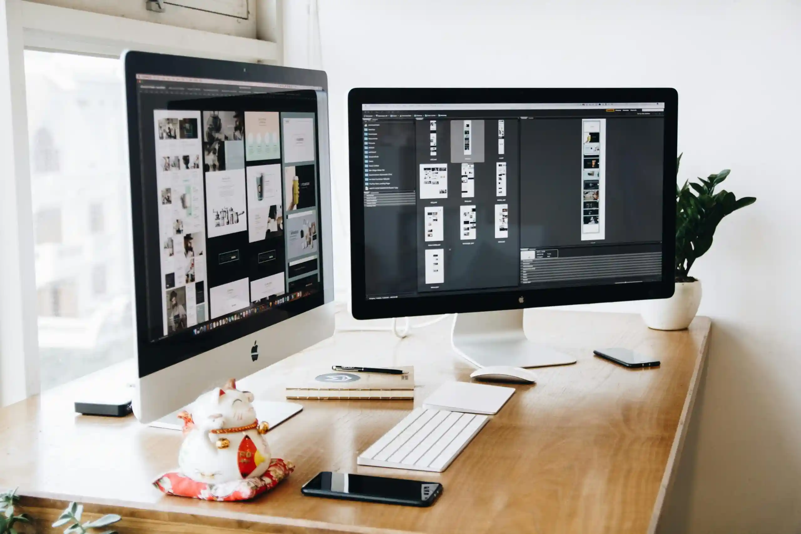 computer on table with website designs